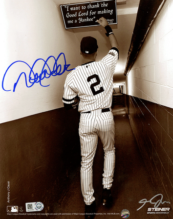 Jeter's hand-signed photo showing him touching the framed quote from Joe DiMaggio "I want to thank the Good Lord for making me a Yankee"